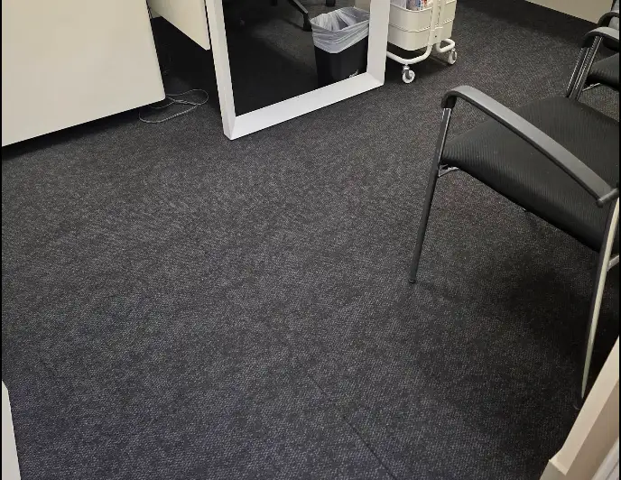 Vacuumed carpet tiles in a reception area