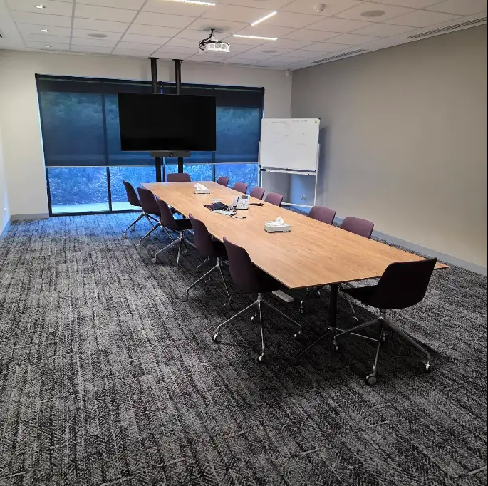 Office boardroom with a long timber table
