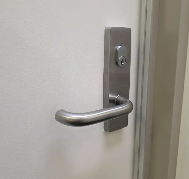 Close-up of a commercial door handle and lock
